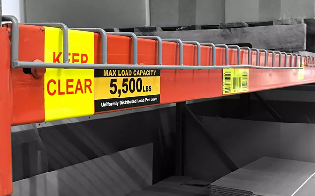 A photo of a load capacity sign to accompany article on warehouse signage