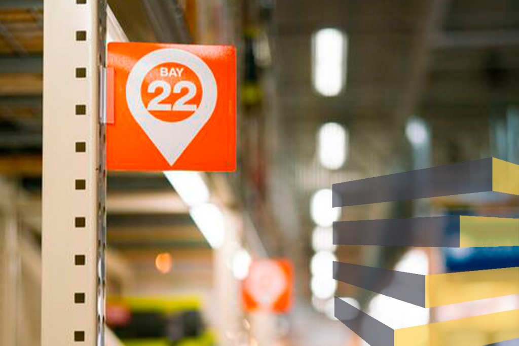 Warehouse aisle signage delineates areas. Photo by Oxana Melis on Unsplash