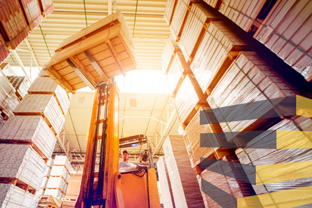 A forklift in warehouse to show different types of pallets