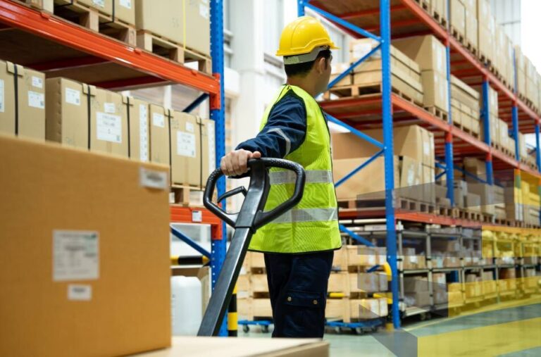 Stock image of a worker in a warehouse to accompany article on warehouse signage solutions