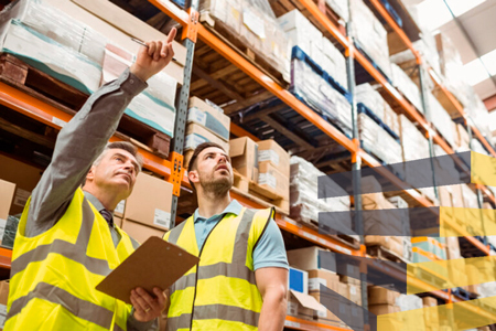 Stock image of people observing things in a warehouse to accompany Serviap Logistics article on working with a warehouse setup consultant.